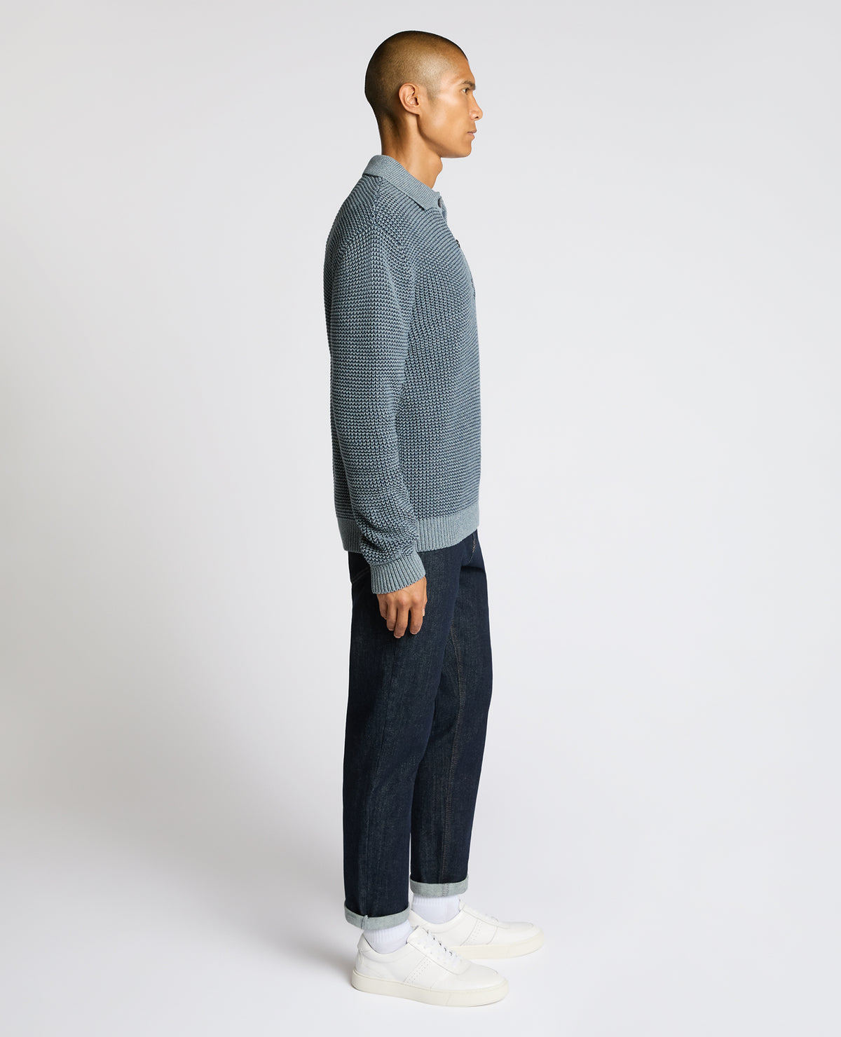 Man wearing a blue Cotton Knit Polo Sweater