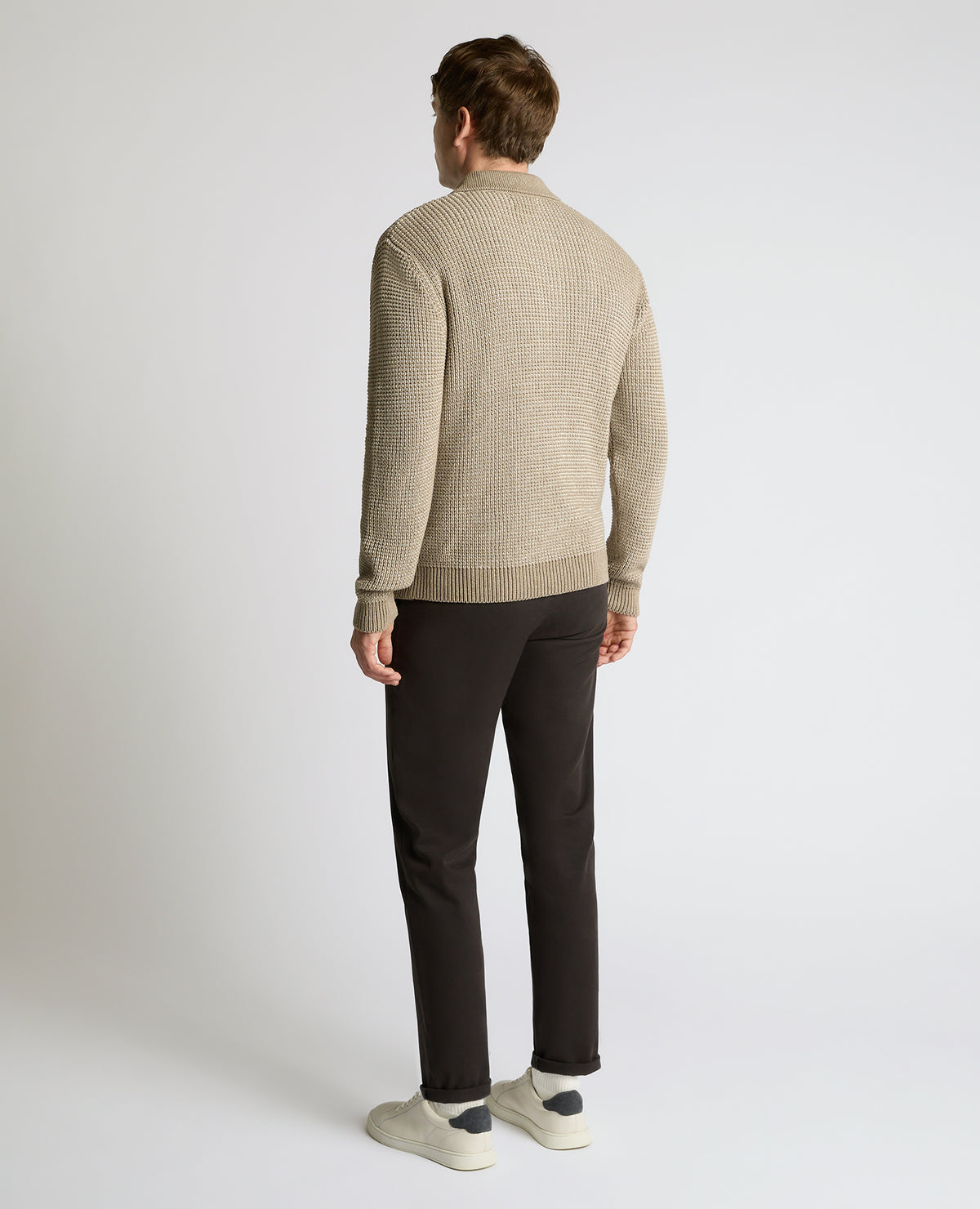 Man wearing a sand Cotton Knit Polo Sweater