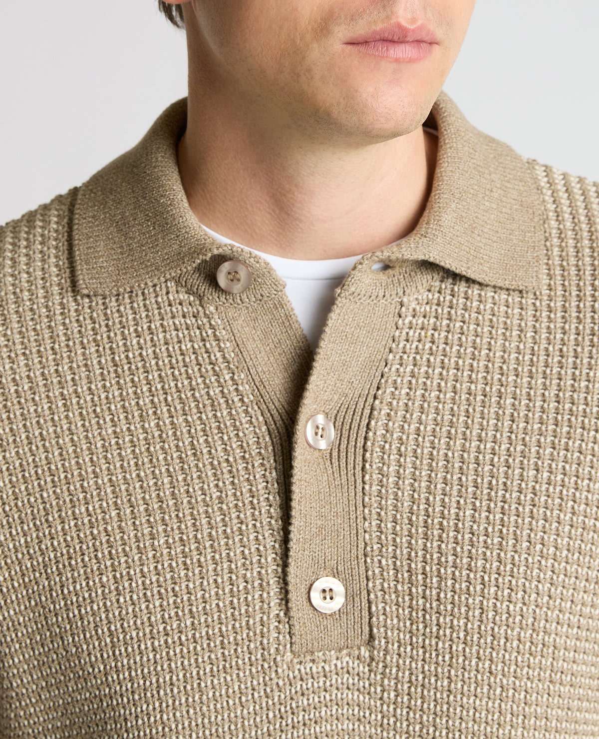 Man wearing a sand Cotton Knit Polo Sweater