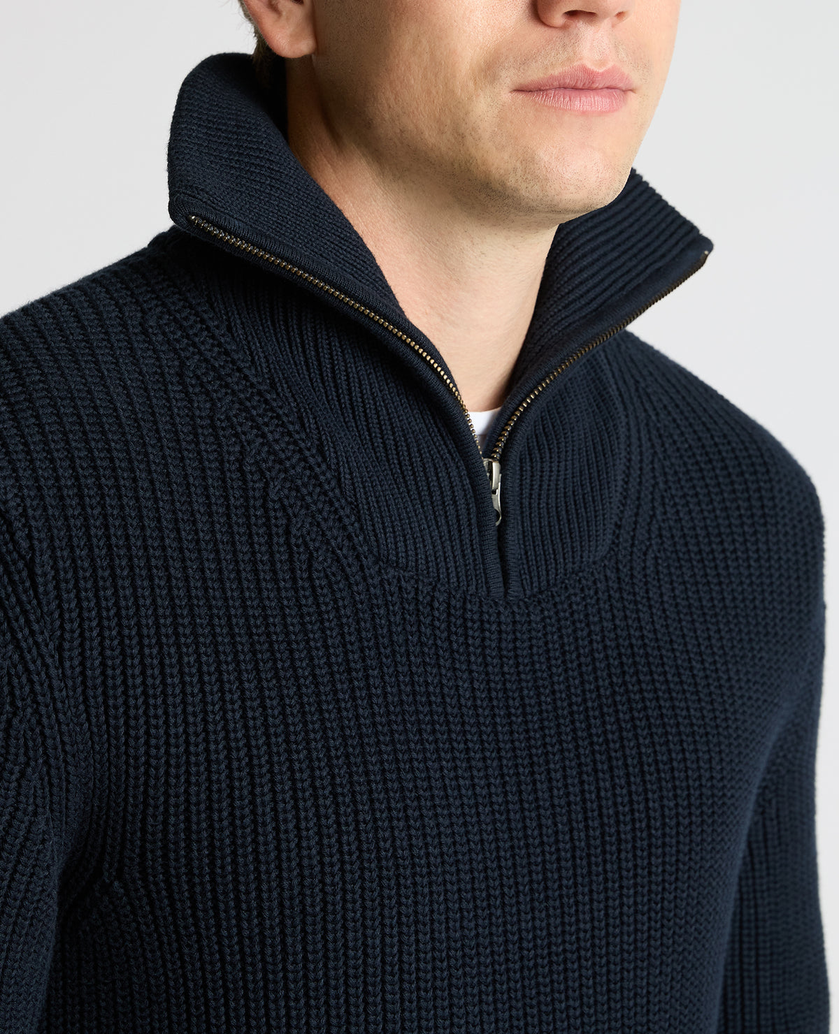 Man wearing a navy Cotton Funnel Neck Knit Sweater
