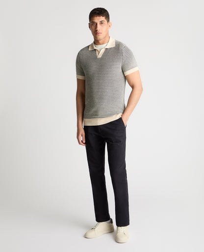 Man wearing a white and navy jumper