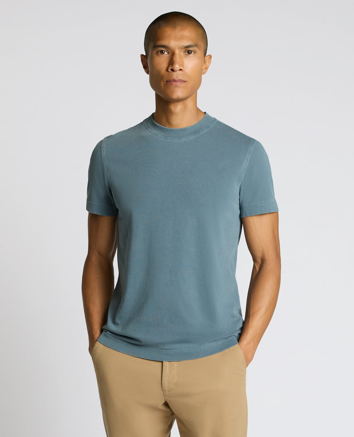 Man wearing a blue Relaxed Fit Organic Cotton T-Shirt