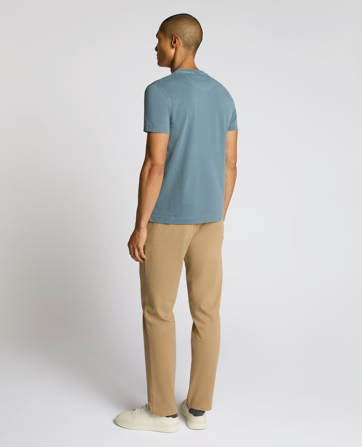 Man wearing a blue Relaxed Fit Organic Cotton T-Shirt