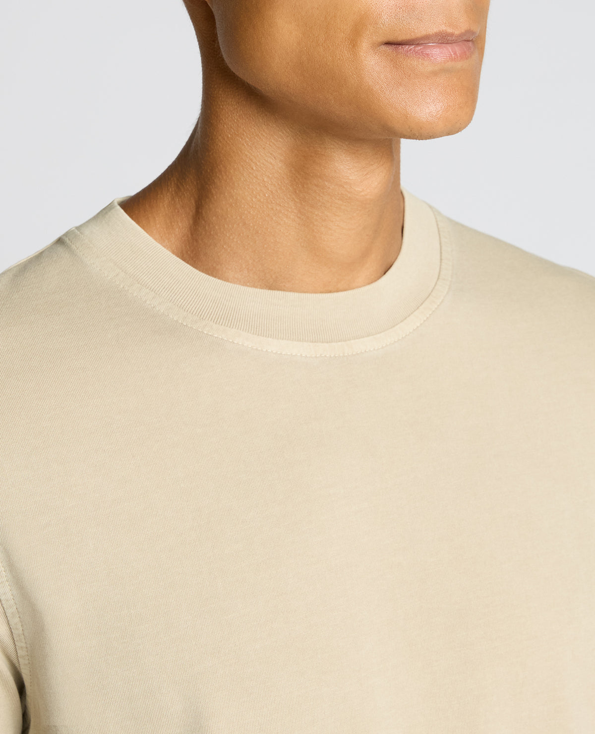 Man wearing a sand Relaxed Fit Organic Cotton T-Shirt