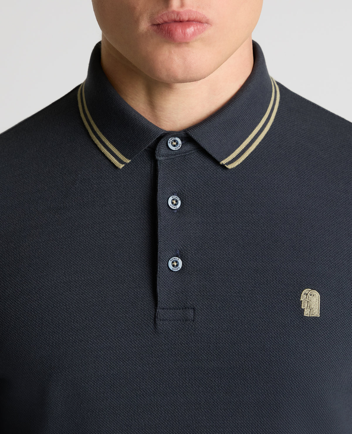 Man wearing a blue Contrast Collar Cotton-Stretch Polo