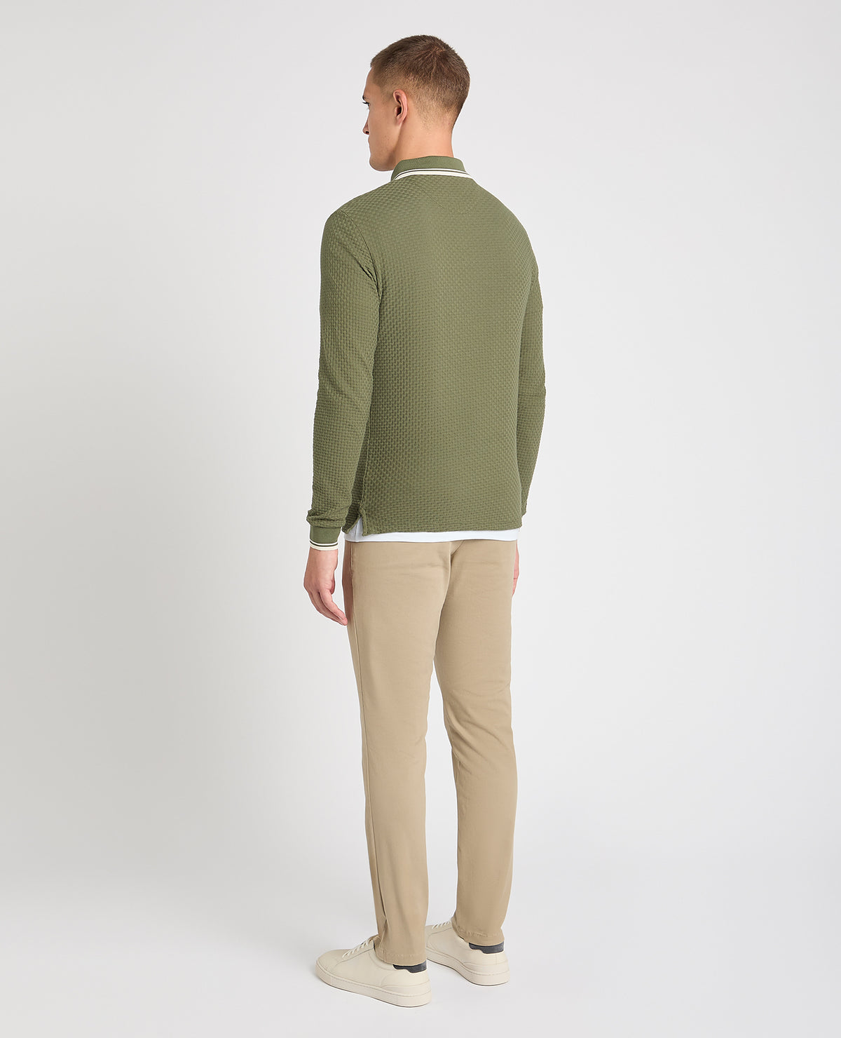 Man wearing a green jumper