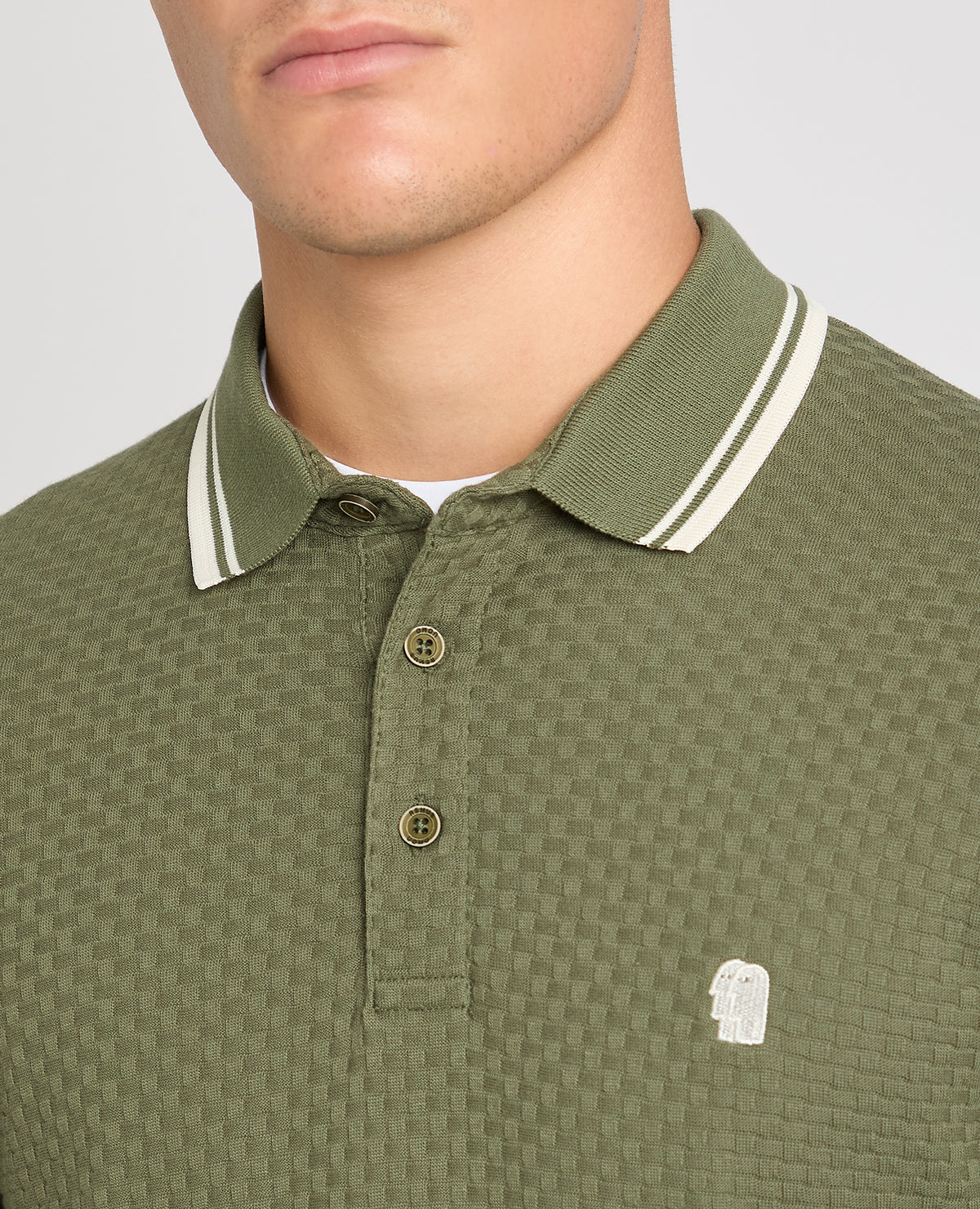 Man wearing a green jumper