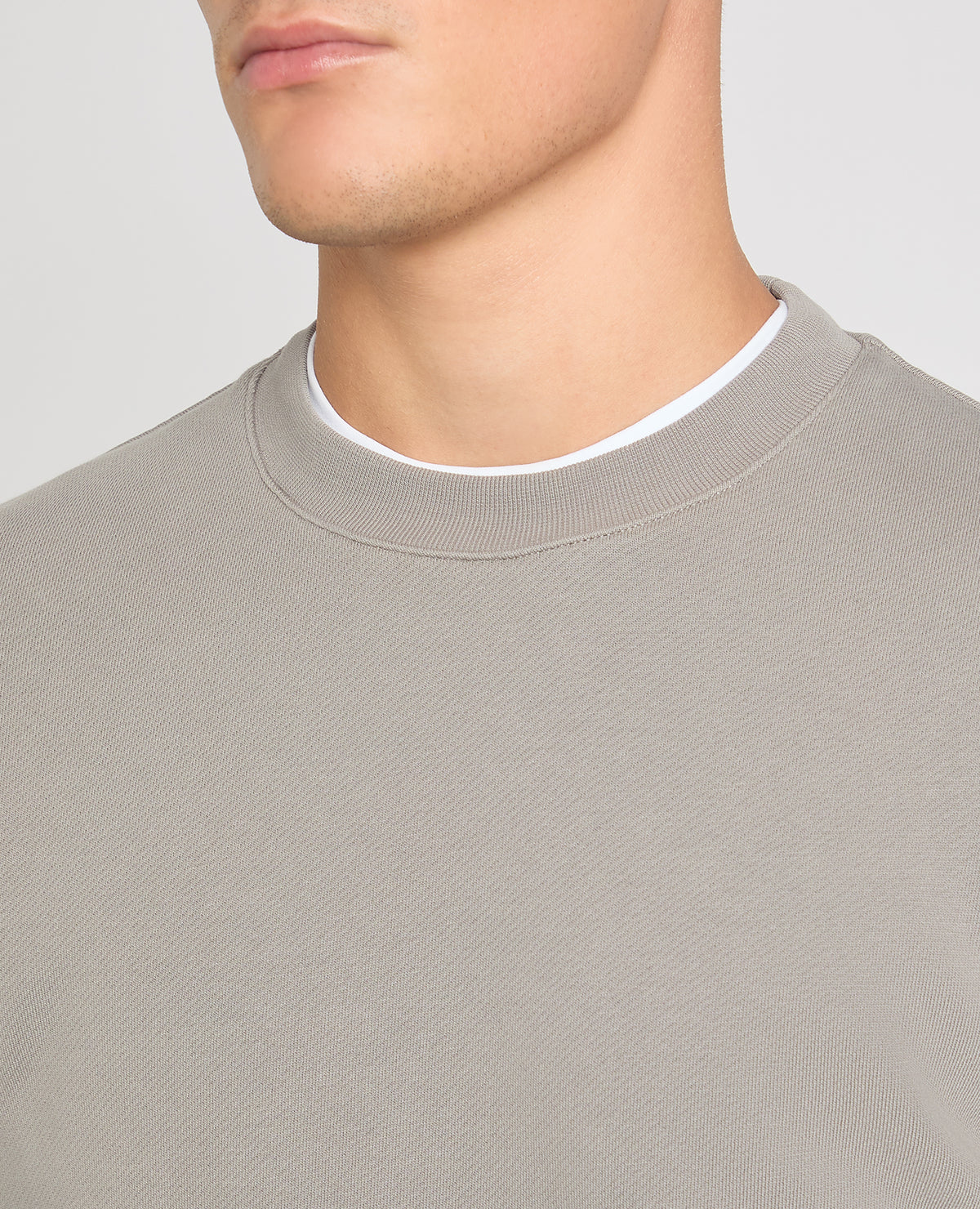 Man wearing a Grey jumper