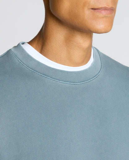 Man wearing a blue Crew Neck Jersey Sweatshirt