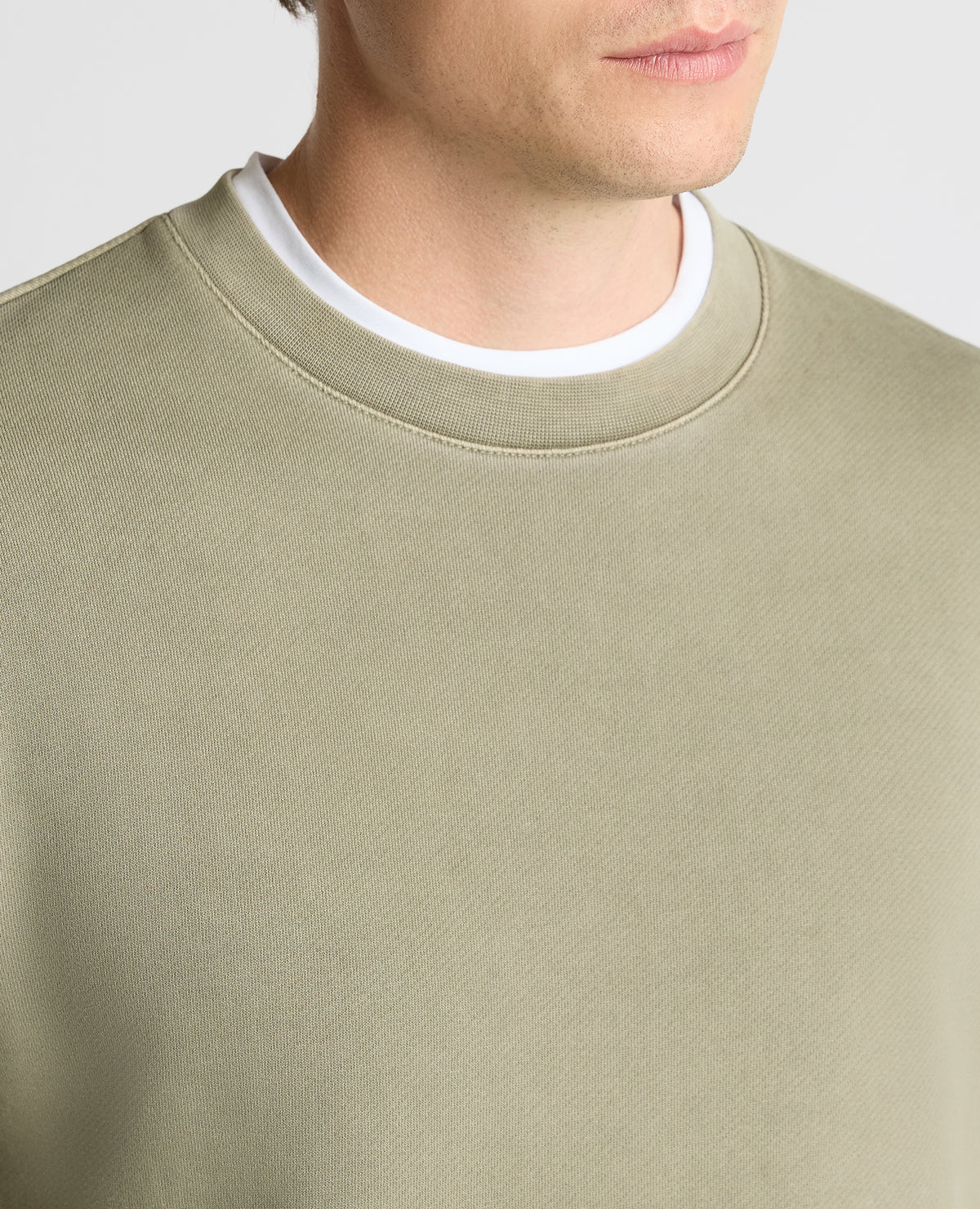 Man wearing a green Crew Neck Jersey Sweatshirt