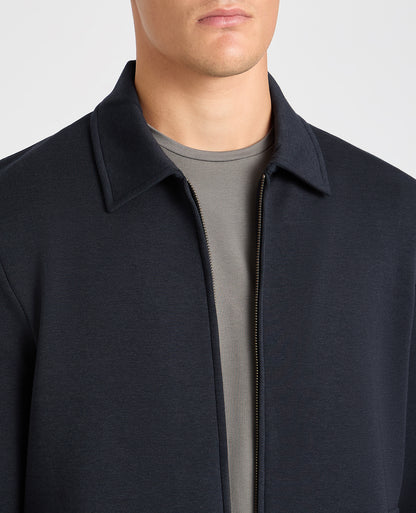 Man wearing a navy jumper
