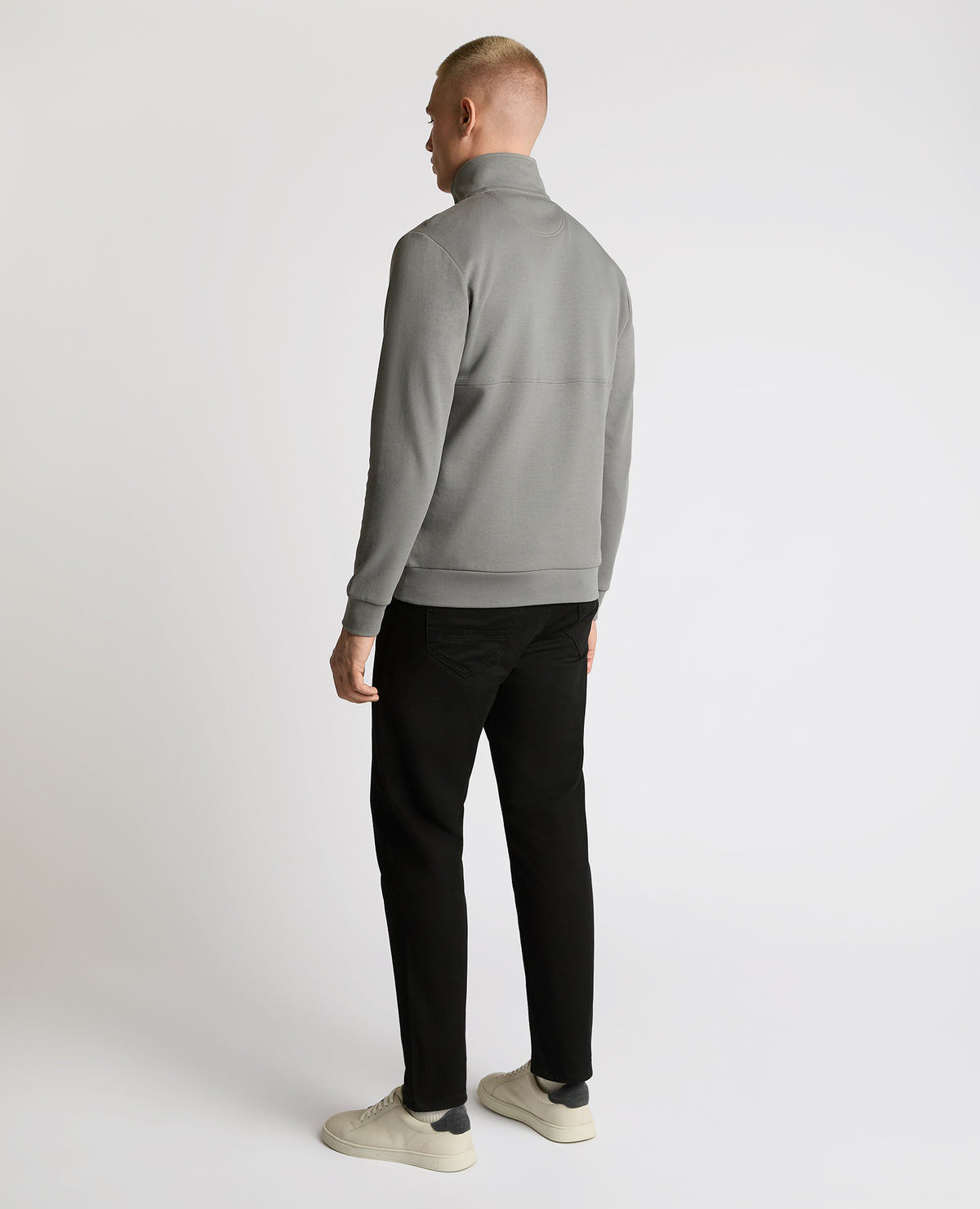 Man wearing a grey Half-Zip Jersey Sweatshirt
