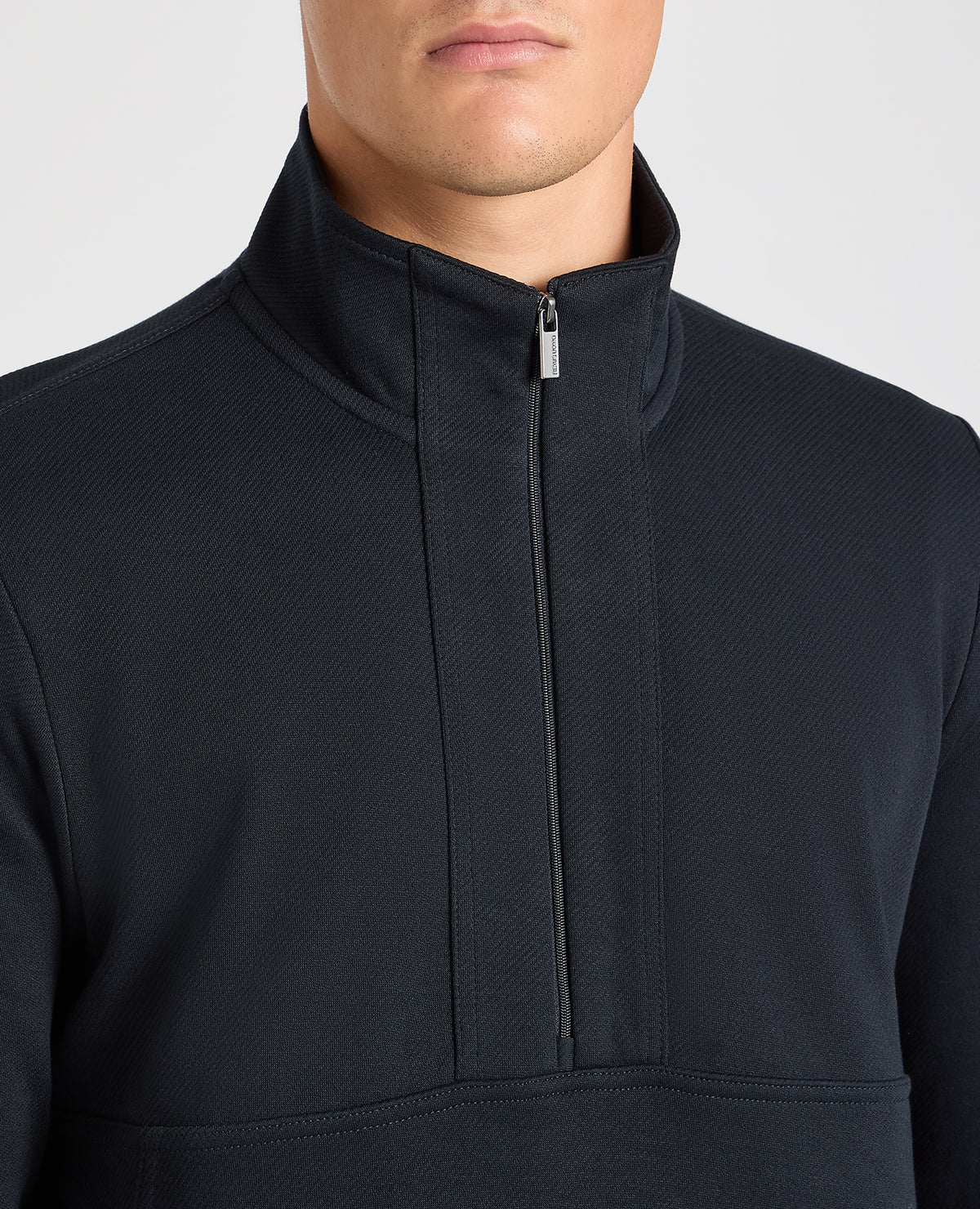 Man wearing a navy jumper