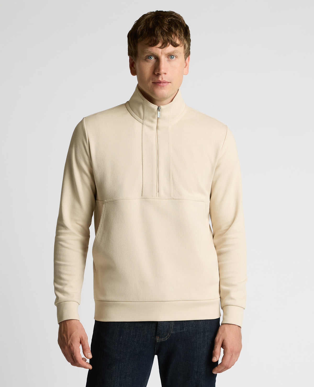 Man wearing a sand Half-Zip Jersey Sweatshirt