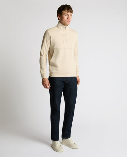 Man wearing a sand Half-Zip Jersey Sweatshirt