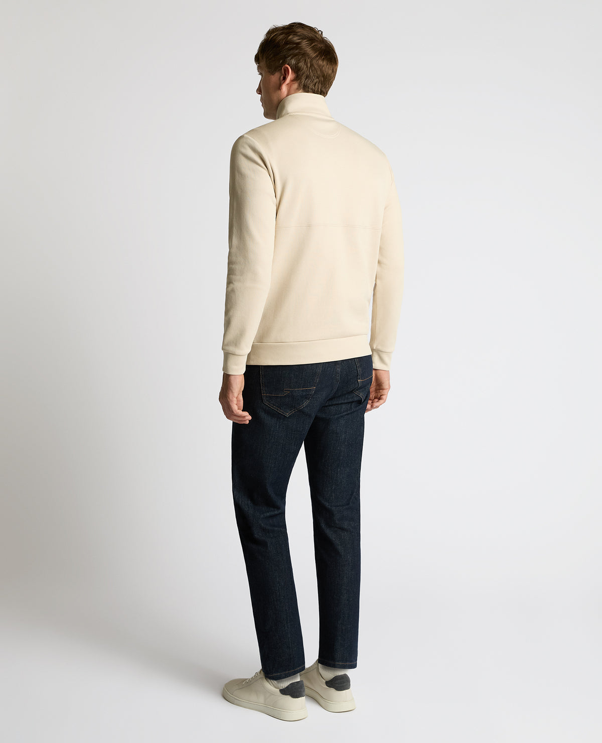 Man wearing a sand Half-Zip Jersey Sweatshirt
