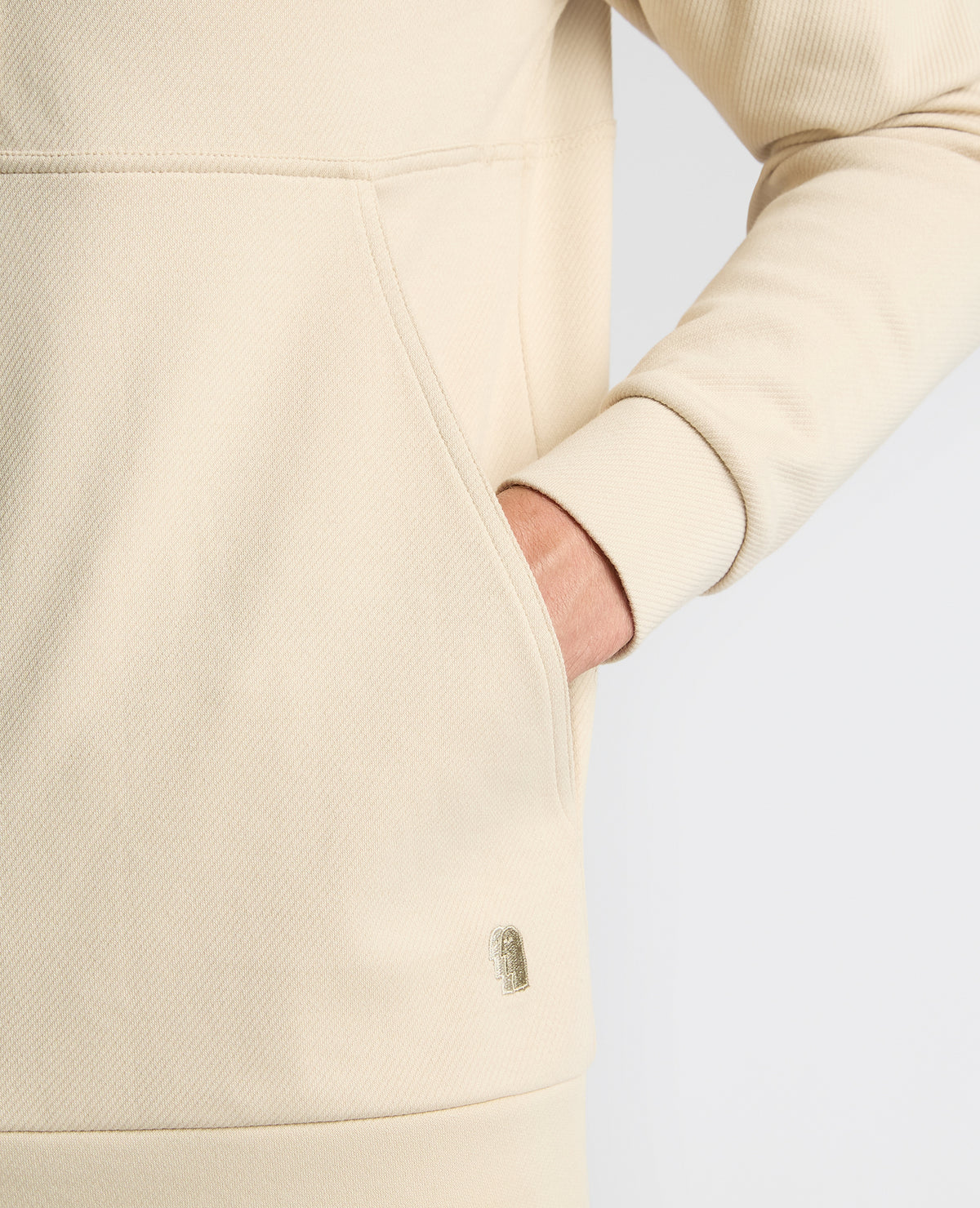 Man wearing a sand Half-Zip Jersey Sweatshirt