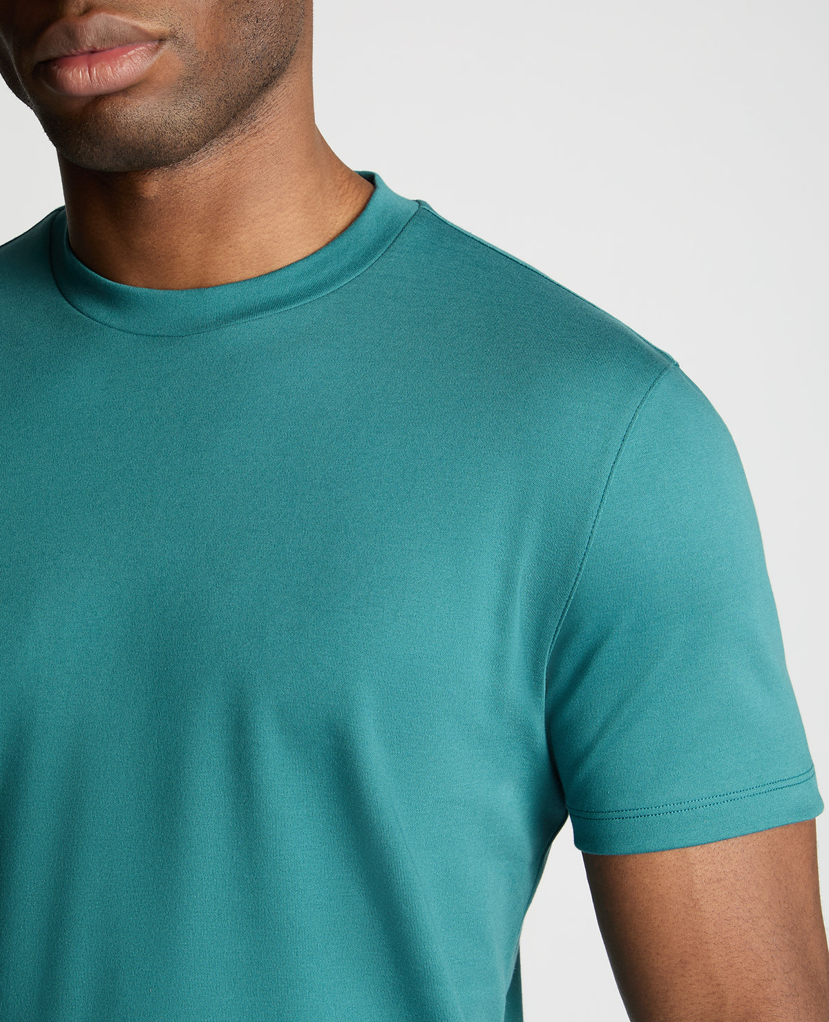 Man wearing a green jumper