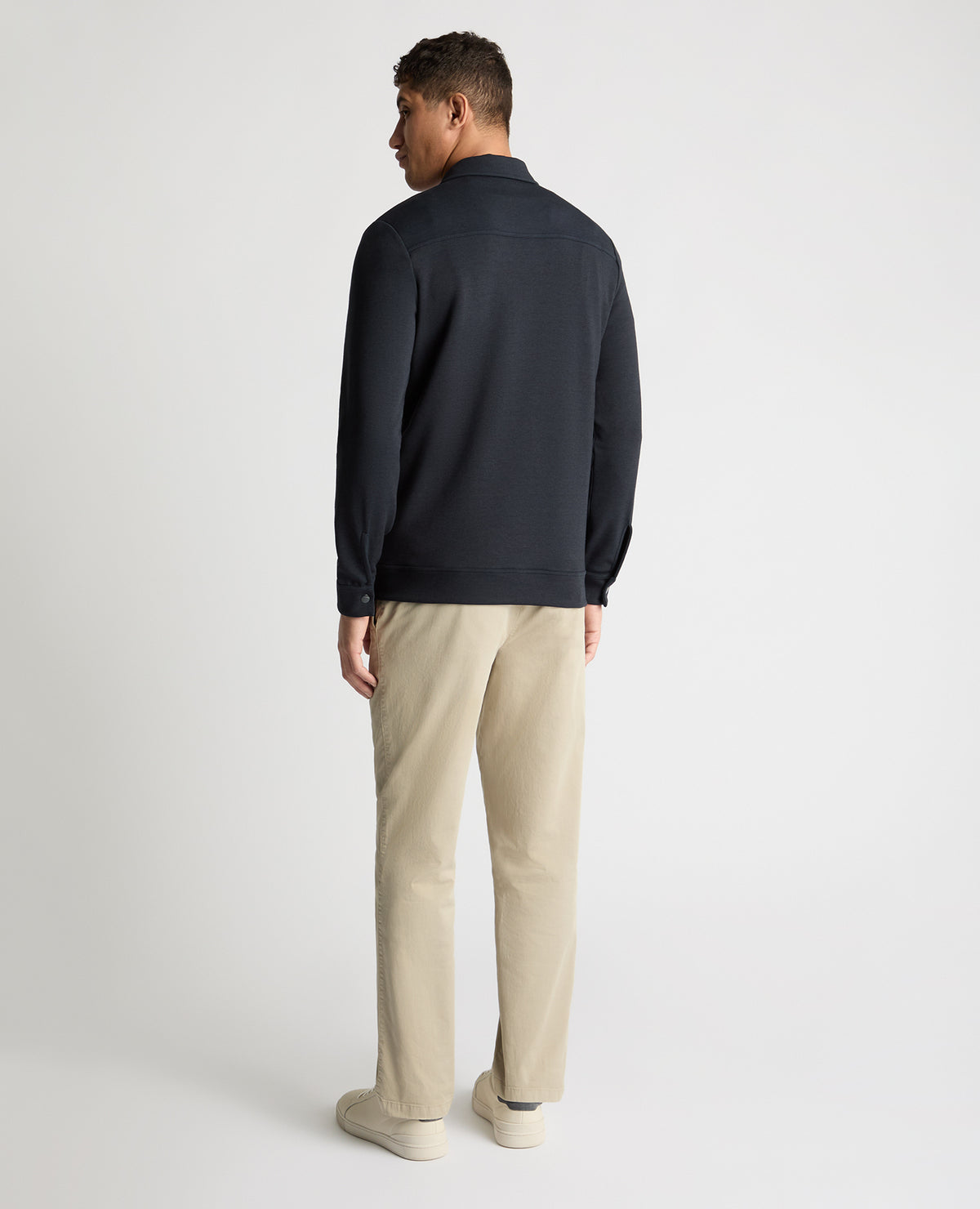 Man wearing a navy jumper