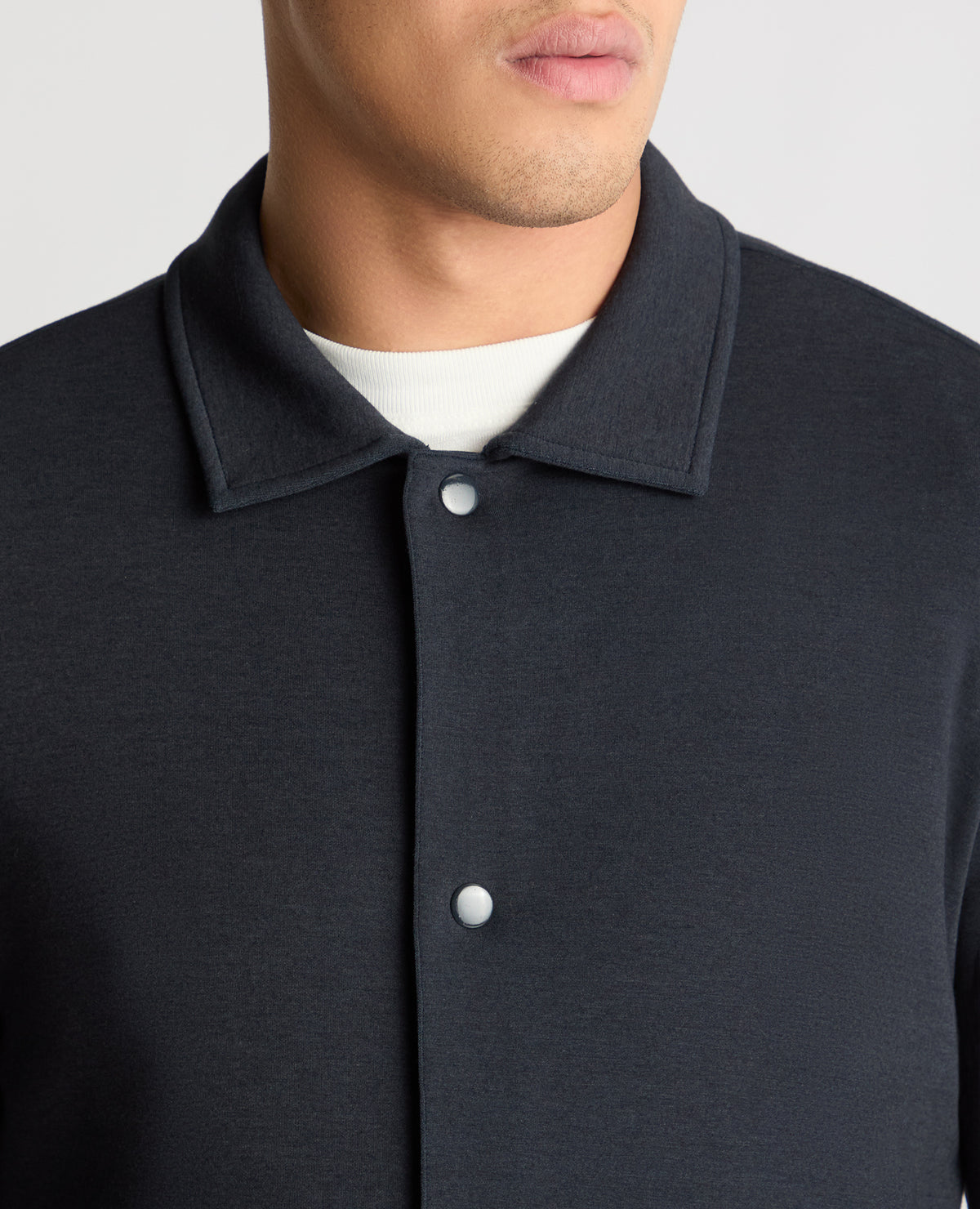 Man wearing a navy jumper