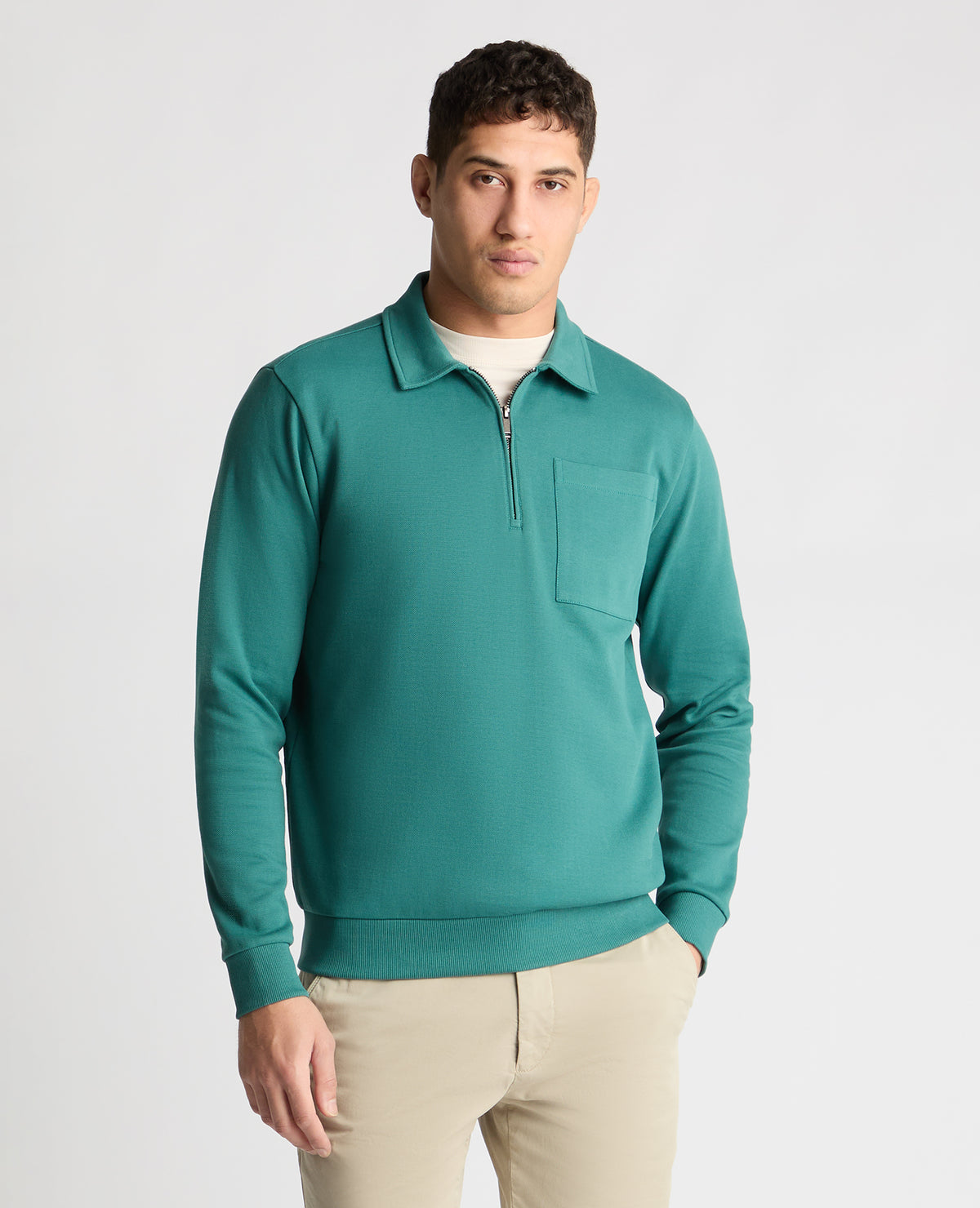 Man wearing a green jumper
