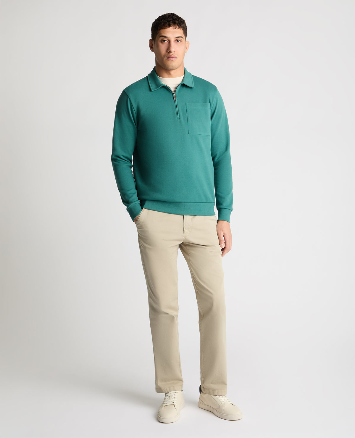 Man wearing a green jumper