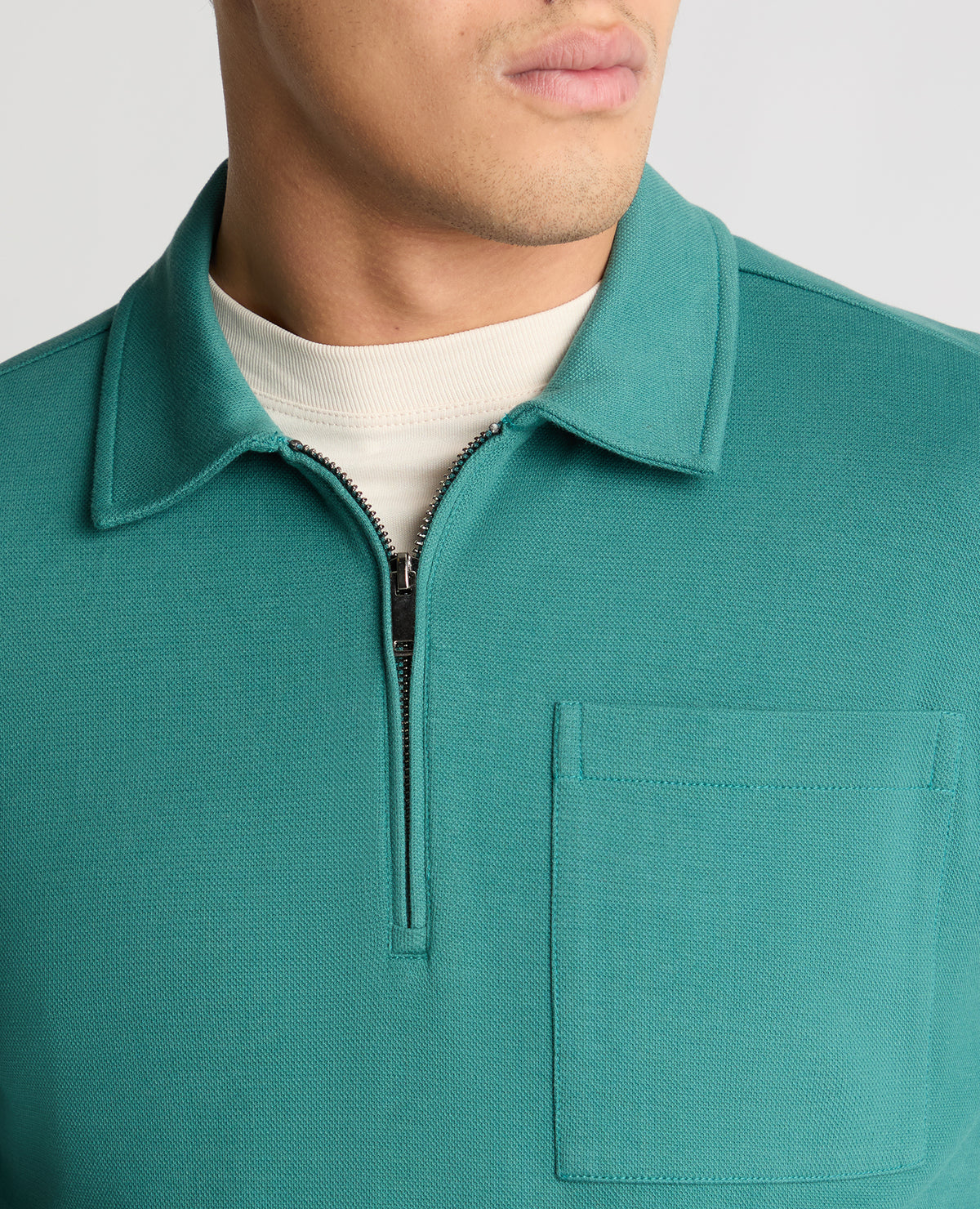 Man wearing a green jumper