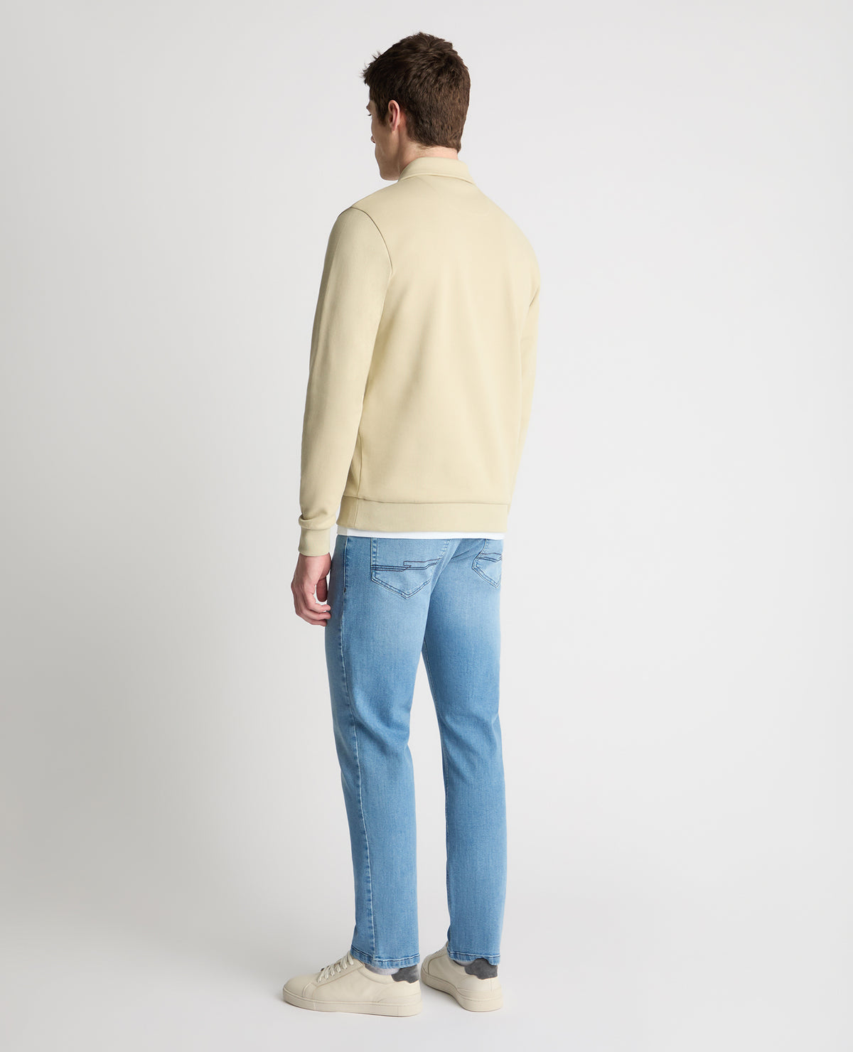 Man wearing a stone jumper