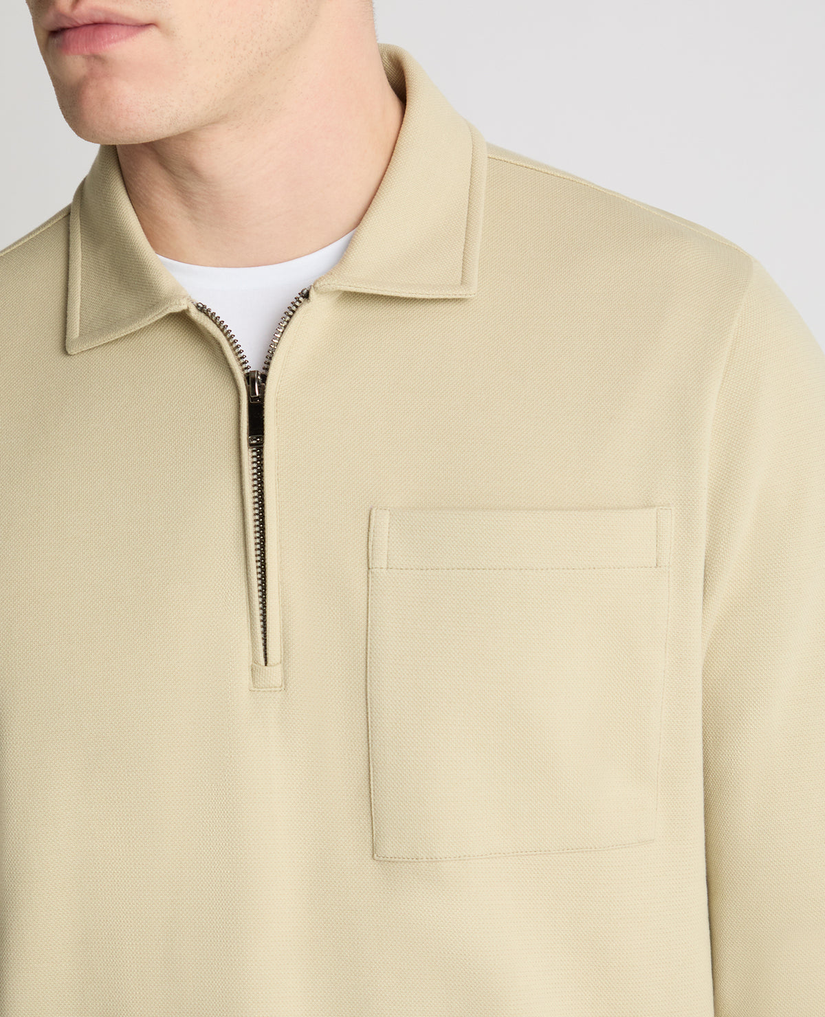 Man wearing a stone jumper