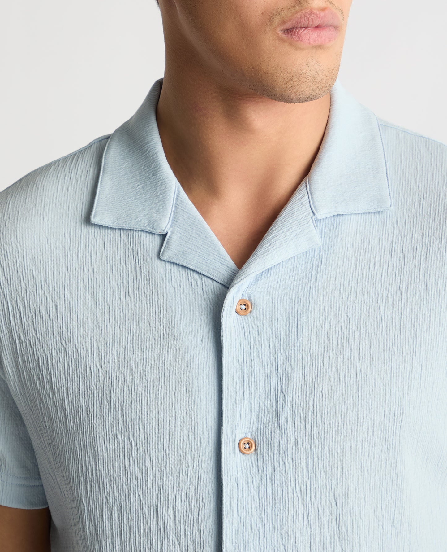 Man wearing a blue jumper