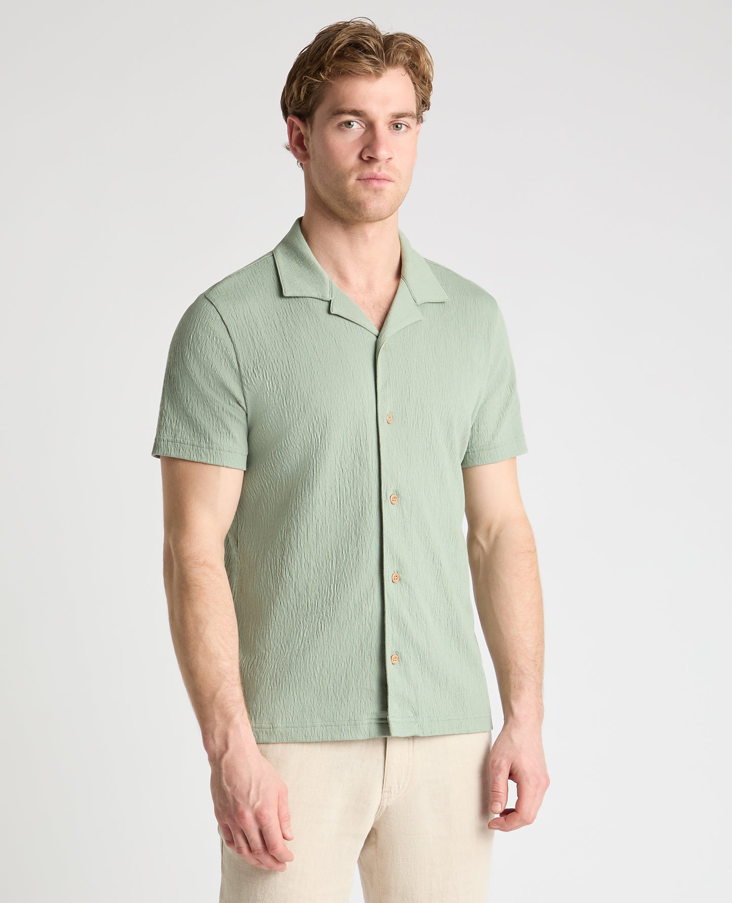 Man wearing a green jumper