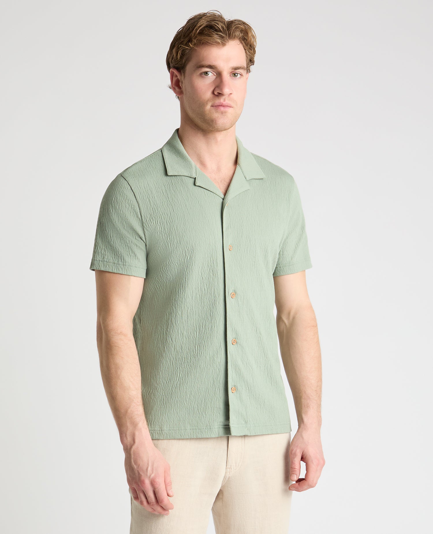 Man wearing a green jumper