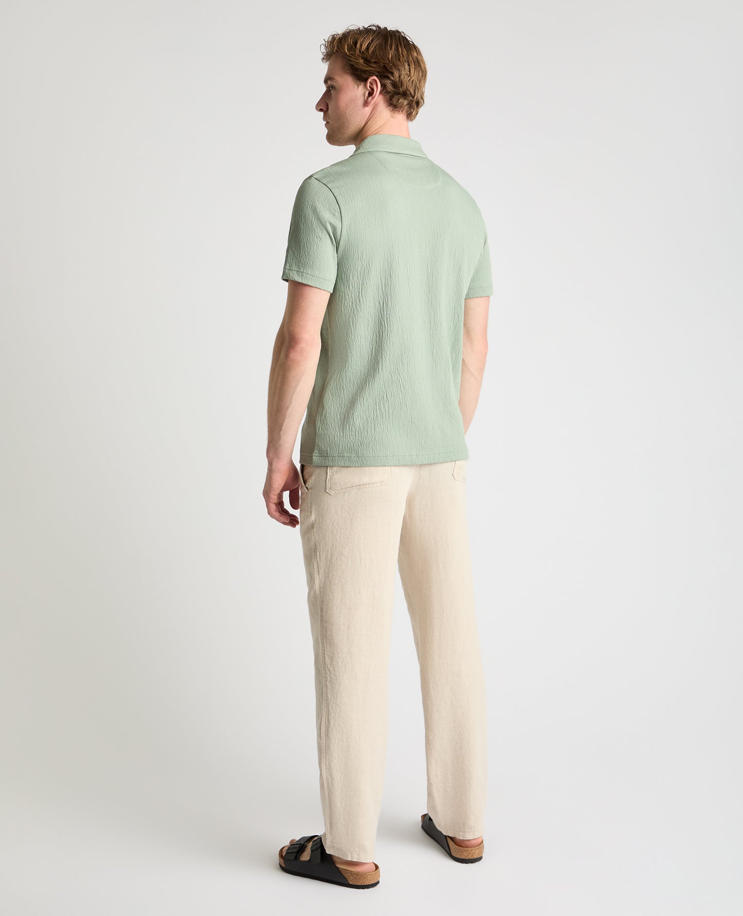 Man wearing a green jumper