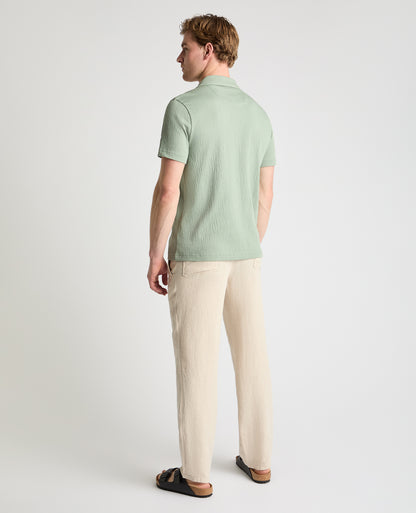 Man wearing a green jumper