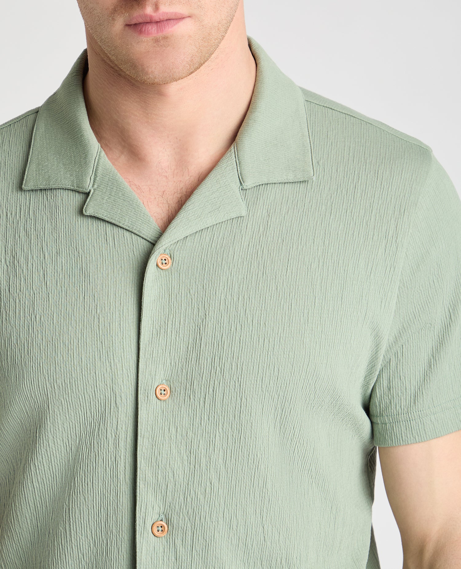 Man wearing a green jumper