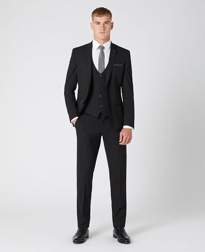 Man wearing a black X-Slim Fit Polyviscose Stretch Mix and Match Suit