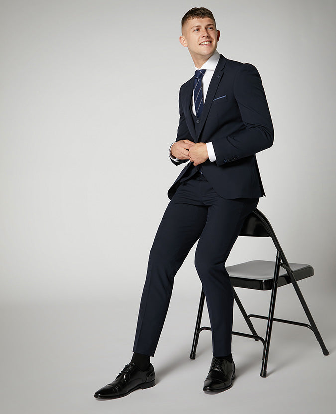 Man wearing a navy X-Slim Fit Stretch Mix and Match Suit