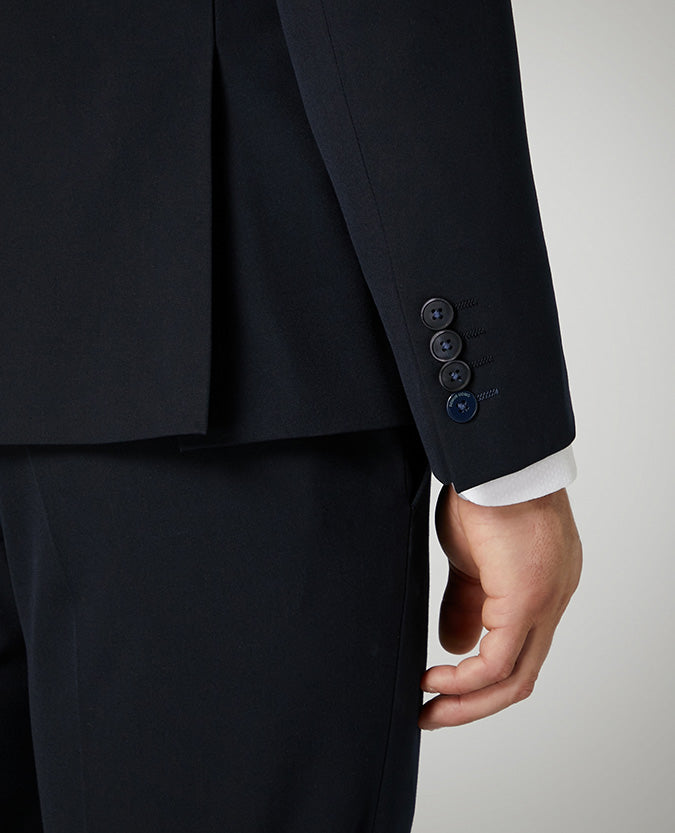 Man wearing a navy X-Slim Fit Stretch Mix and Match Suit