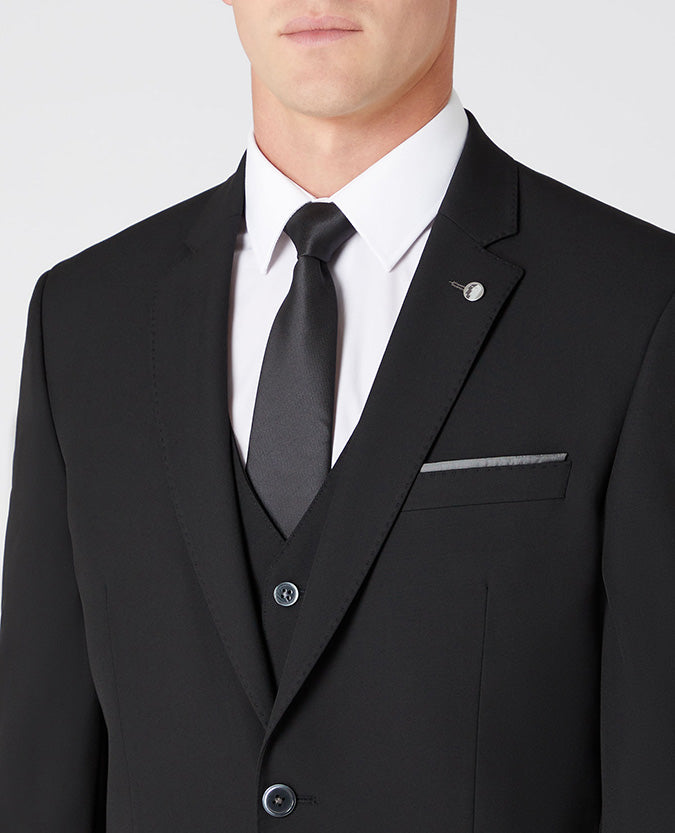 Man wearing a black Tapered Fit Stretch Mix and Match Suit