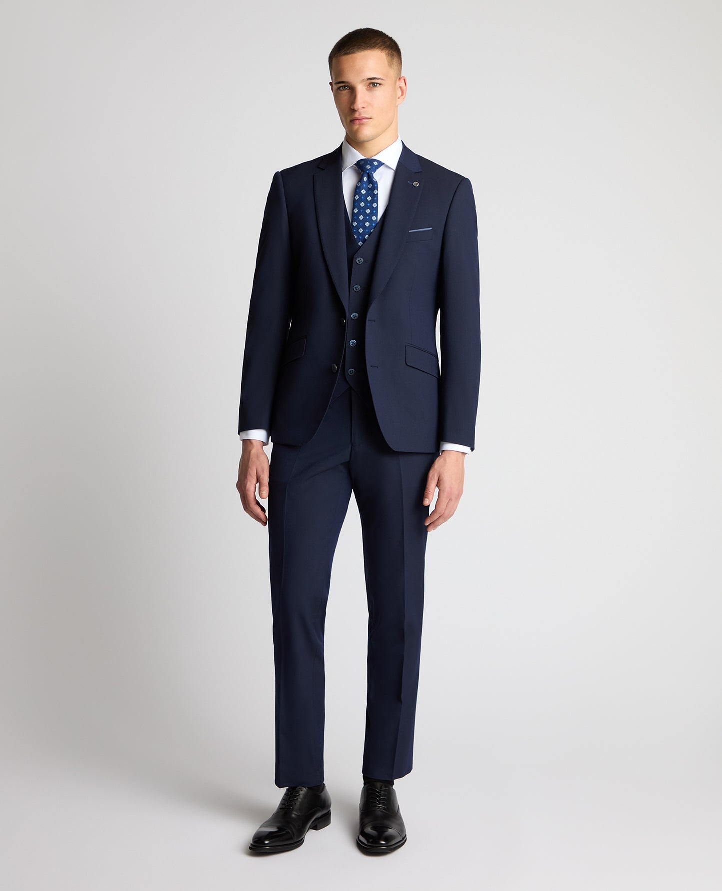 Man wearing a navy suit
