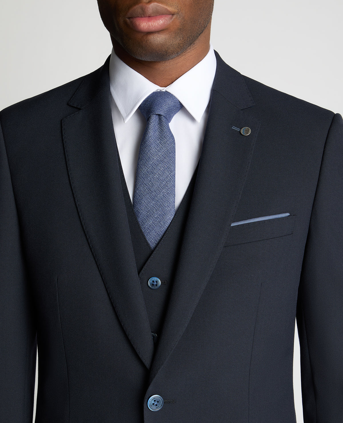 Man wearing a navy suit