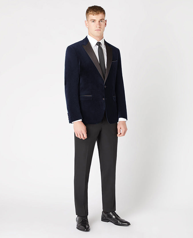 Man wearing a navy Slim Fit Velvet Jacket