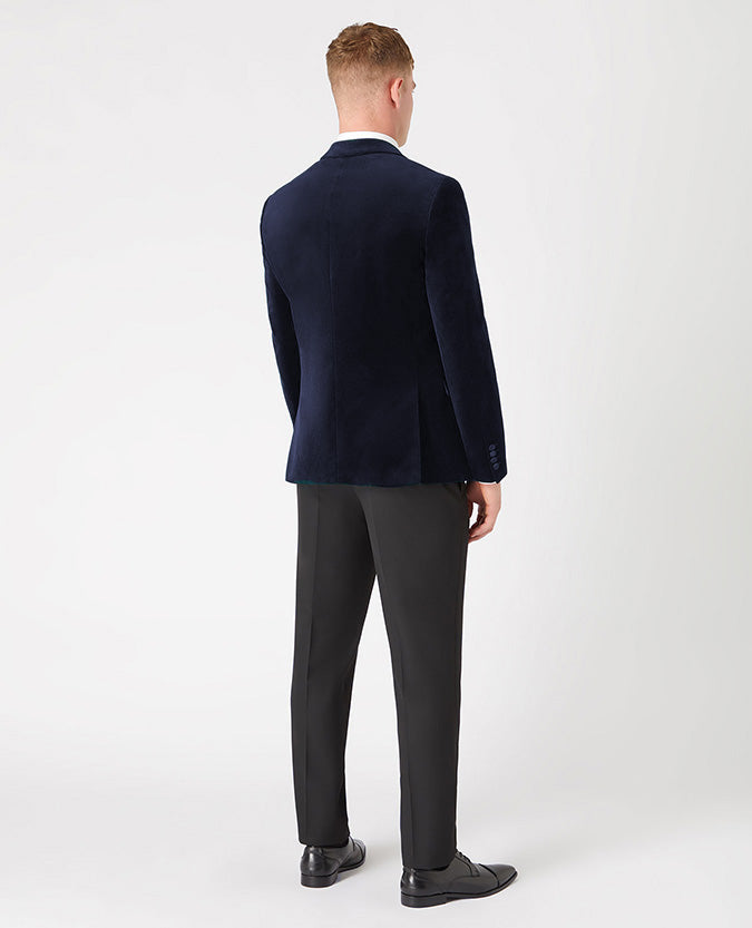 Man wearing a navy Slim Fit Velvet Jacket
