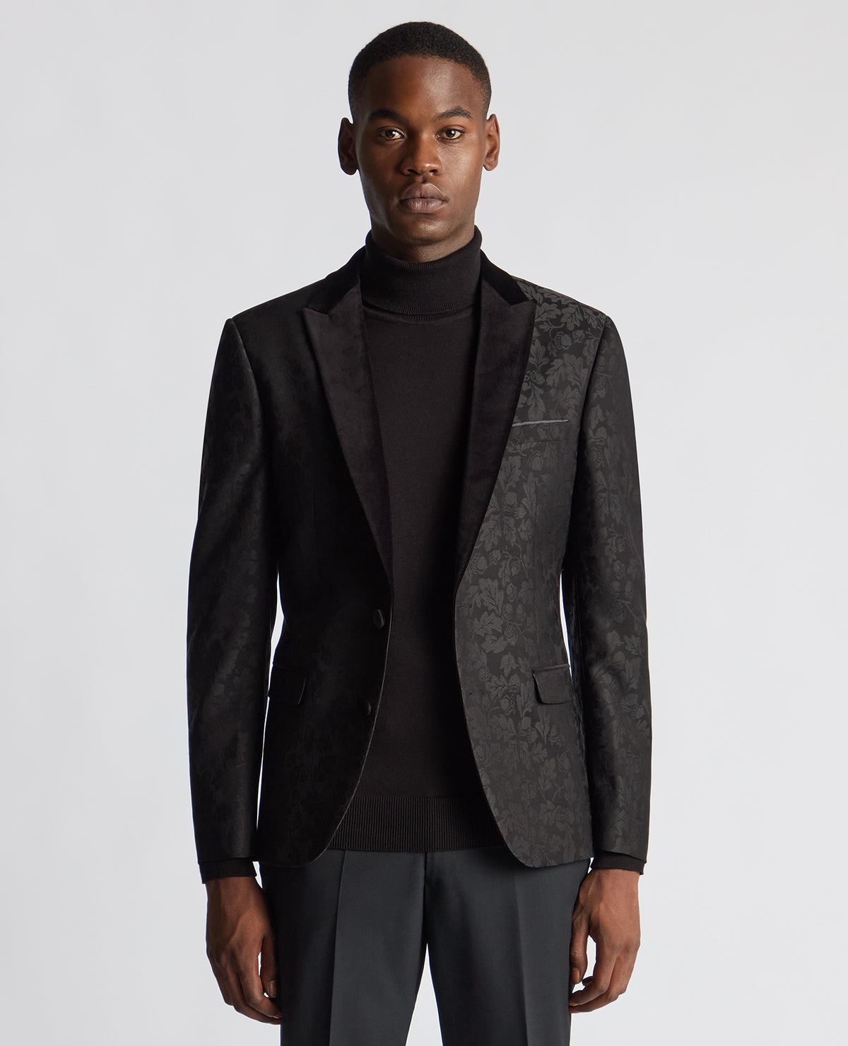 Man wearing a black Slim Fit Floral Dinner Jacket