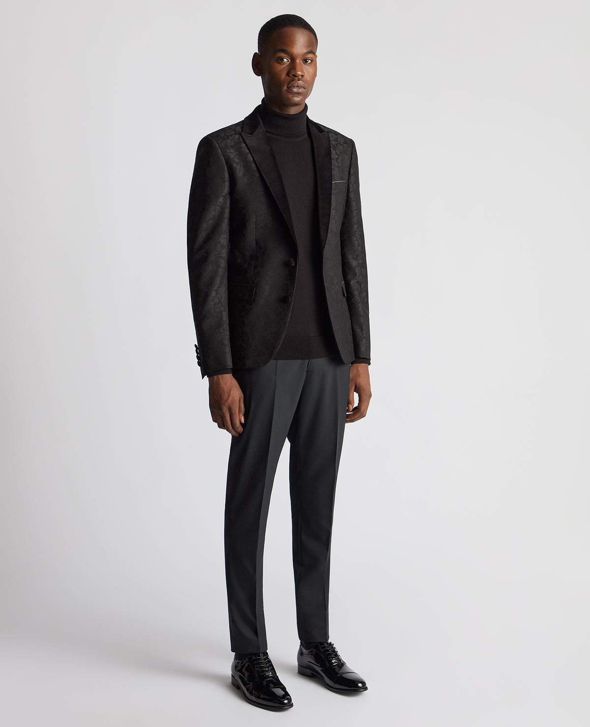 Man wearing a black Slim Fit Floral Dinner Jacket