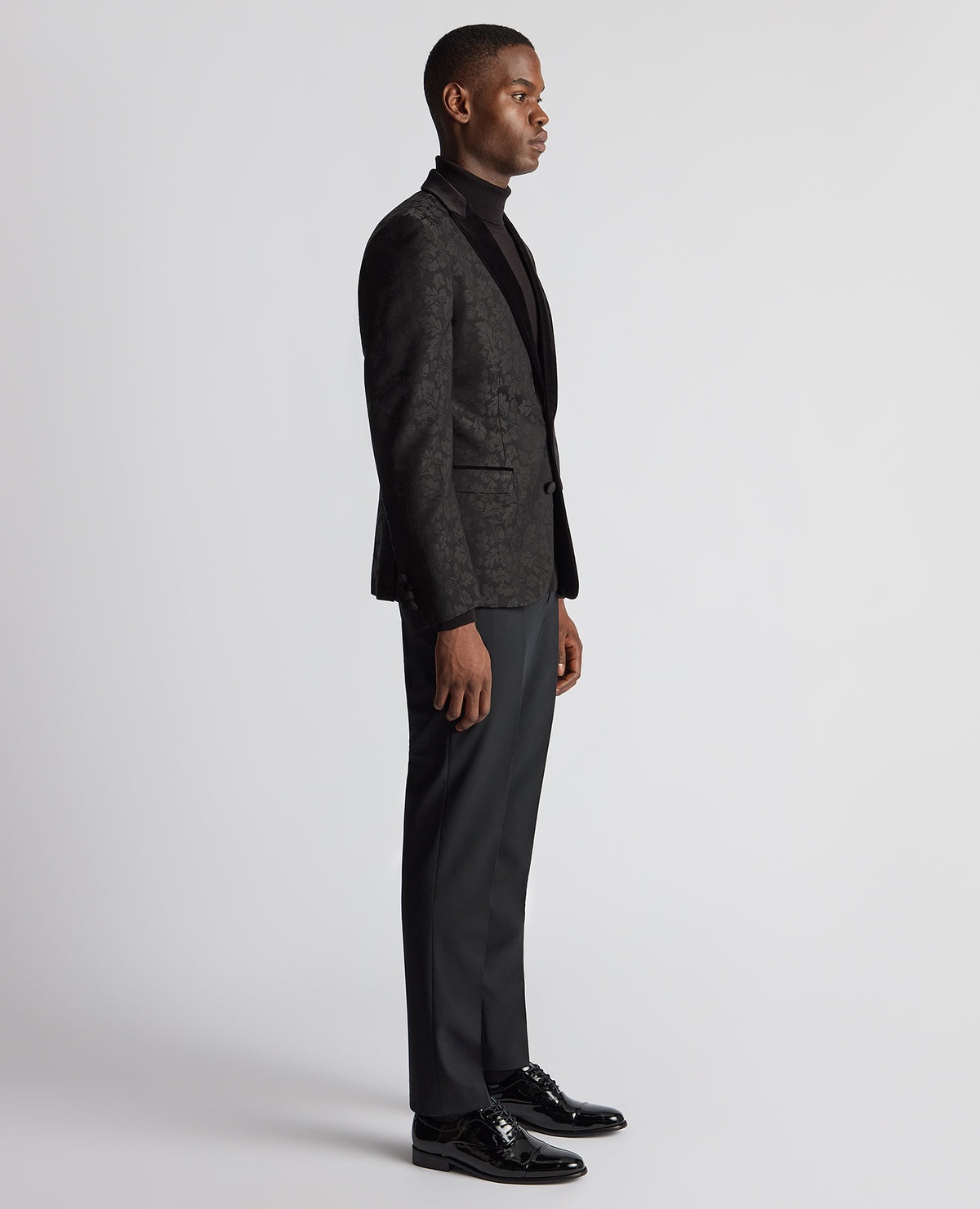 Man wearing a black Slim Fit Floral Dinner Jacket