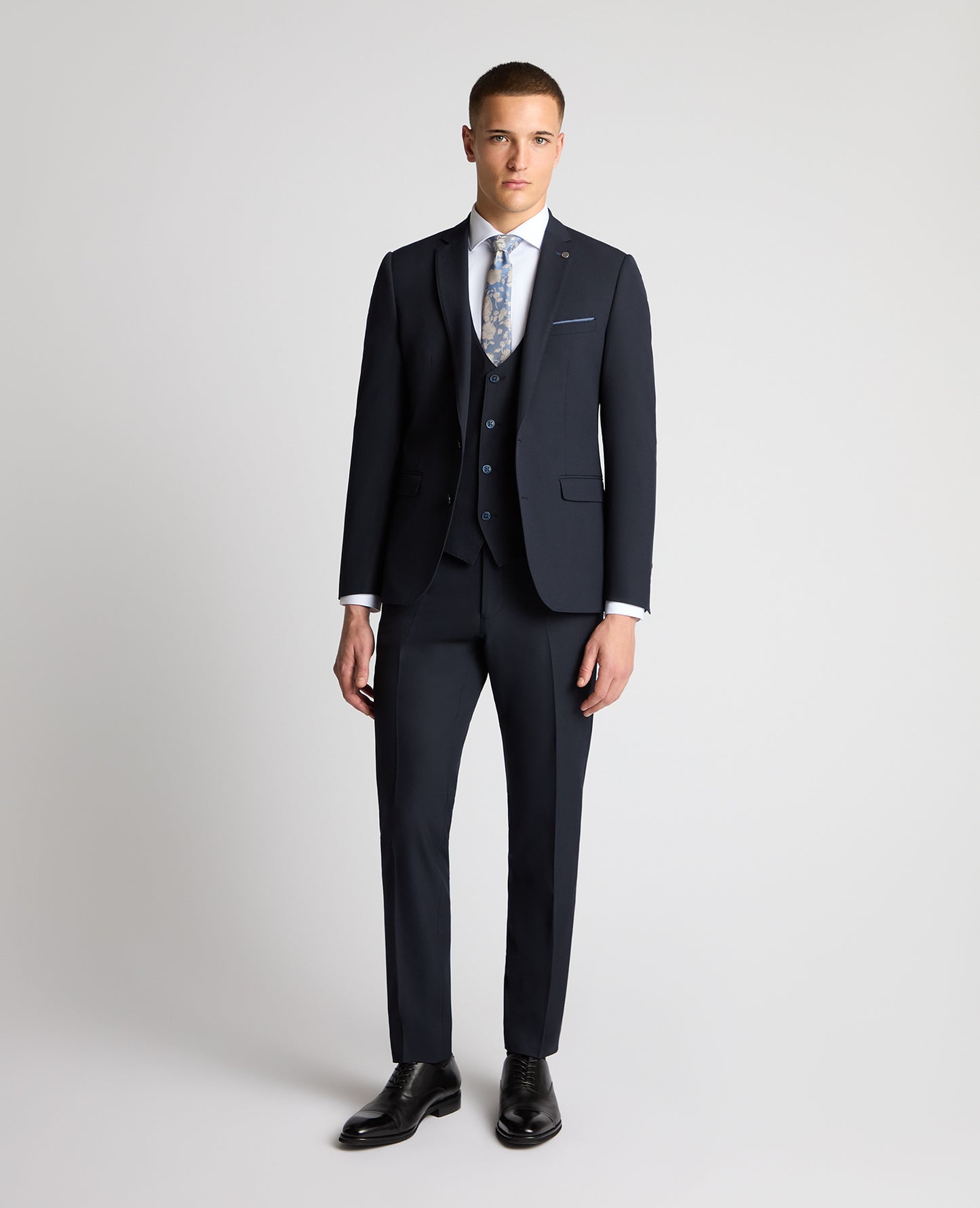 Man wearing a navy suit