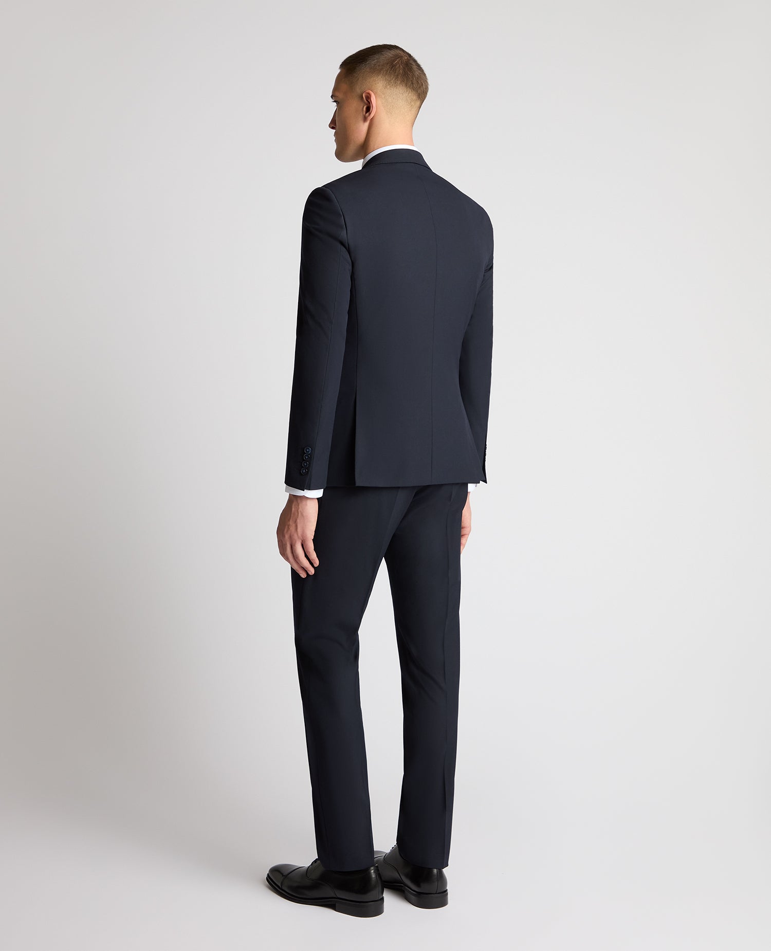 Man wearing a navy suit