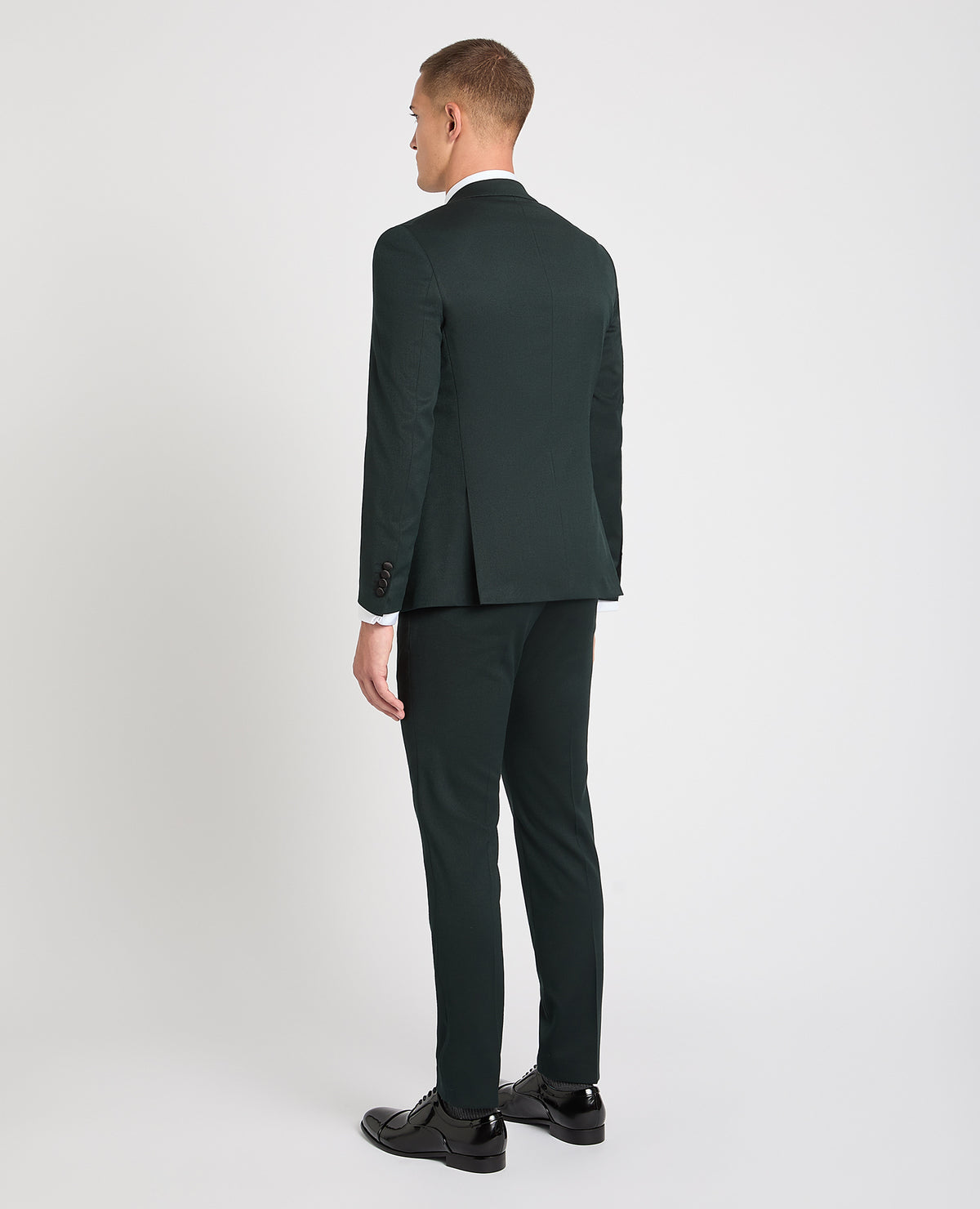 Man wearing a green suit