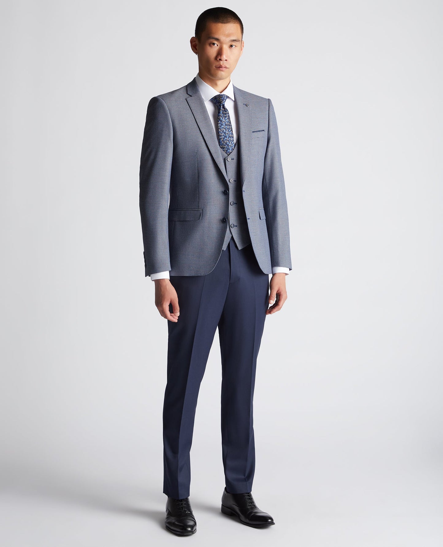 Man wearing a blue Slim Fit Stretch Mix and Match Suit Jacket